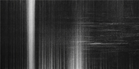 Abstract black and white background featuring a dark textured metal surface with a grunge silver pattern and rough vintage steel material design