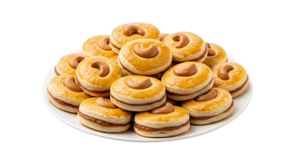 Delicious cashew-topped round cookies with a sweet filling arranged on a white plate isolated on transparent background