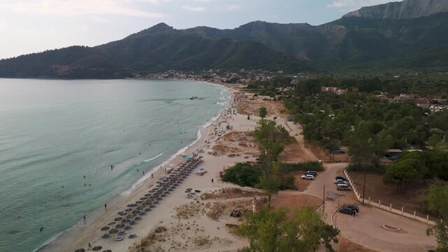 Scenic Aerial Drone Shot Tracking Along Golden Beach Bay and Turquoise Aegean Sea Coastline on Thasos Island, Greece.