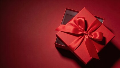 Elegant red gift box with satin ribbon bow, ready for a special occasion