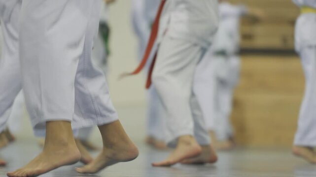 children jumping while practicing karate