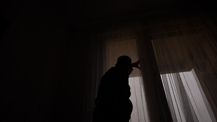 Man with headache, depression, sadness and loneliness at home