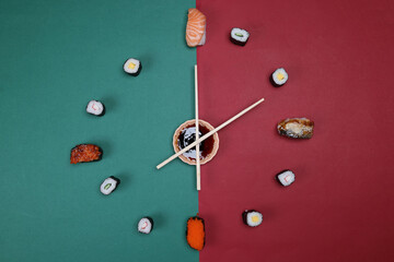 sushi chopsticks hour minutes hand mini sauce bowl rotating on green red paper clock watch time