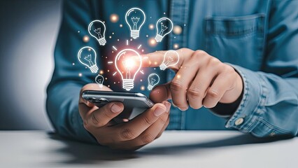 Man holding smartphone with glowing light bulb icons, symbolizing new ideas and innovation.