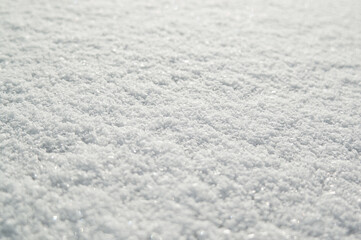 Gray-white background, close-up of snow texture in the photo