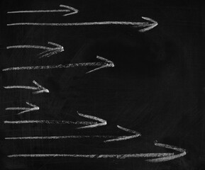 Hand draw directional arrows, black chalkboard, old blackboard background and texture
