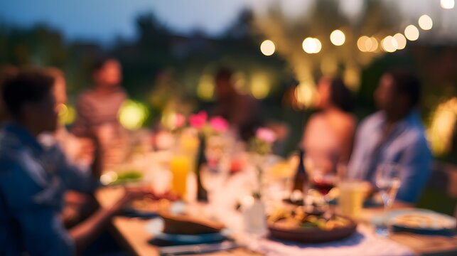 Warm twilight illuminates joyful friends sharing an alfresco dinner celebrating connection and a simple shared moment