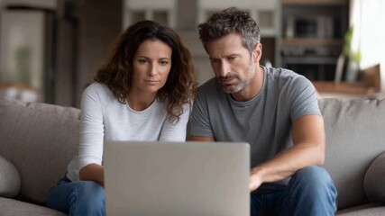 Focused Duo: A couple engages in a focused and intimate moment as they engross themselves in the digital world of a laptop, revealing a shared connection and intent.  - Powered by Adobe