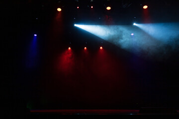 scene, stage light with colored spotlights and smoke