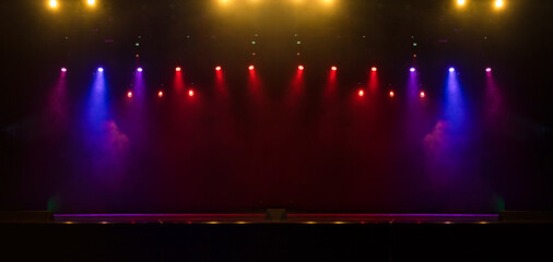 scene, stage light with colored spotlights and smoke