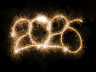 New Year 2026 arranged from sparking digits over black background