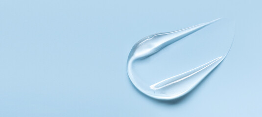 cosmetic texture gel essence smear on a blue background close-up