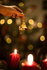 It is time! Cozy Candle-Lit Christmas Table with Festive Holiday Decor - hand ringing a bell
