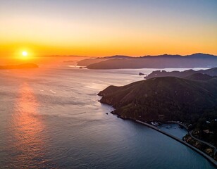 Sunrise over Serene Coastal Mountains and Ocean