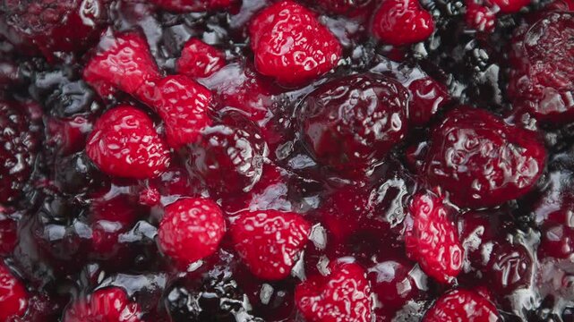 Rich berry filling with shine, Shimmering berry compote bubbling in rustic kitchen setting, Sweet and glossy raspberry filling simmering in syrup with reflective highlights