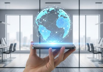 Hand holding smartphone with holographic globe and network connections in office