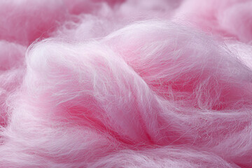 Close-up view of cotton candy texture showing airy sugar fibers in pink color