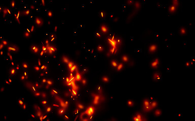 Dense cloud of luminous red and orange fire sparks drifts across deep black background creating dynamic ethereal atmosphere