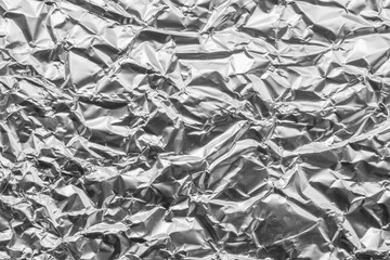 Shiny metal silver gray foil leaf crumpled texture background