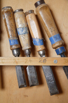 Wood chisels with wooden handles in carpentry workshop Schaeftlarn