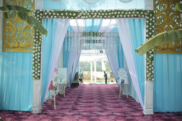 Beautifully decorated wedding venue featuring elegant floral arrangements, soft ambient lighting,...
