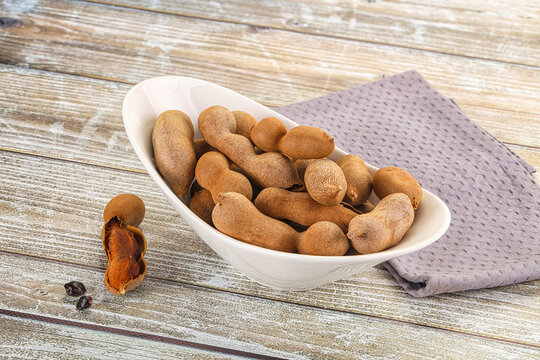 Tropical exotic Tamarind fruit heap