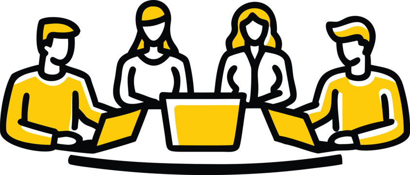 Four people sitting around a table with laptops and a box