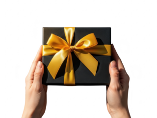 Two hands holding a black gift box with a yellow ribbon tied around it isolated on transparent background