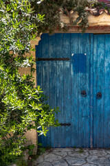 Blue wooden door in Afytos village, Chalkidiki, Greece