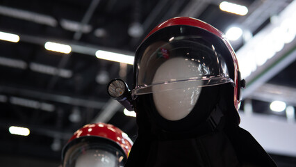 Detailed mannequin with side mirror, Closeup view showing detailed mannequin helmet adjacent to mirror, Detailed closeup of mannequin helmet with adjacent side mirror reflection