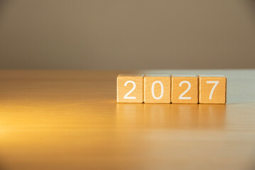 Craft wooden cube blocks 2027. Numbers on wooden blocks with copy space. 2027 happy new year idea concept.