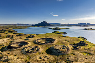 view of the Skutustadagigar pseudo craters and Myvatn Lake in northern Iceland in high summer © makasana photo
