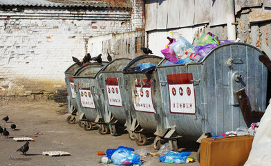 Dumpsters being full with garbage