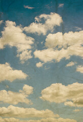 Vintage background in the blue sky with clouds