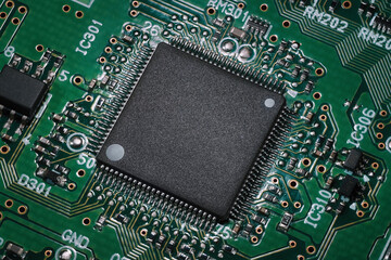 Semiconductor on a circuit board. Macro shot of a chip integrated in a modern electronic device