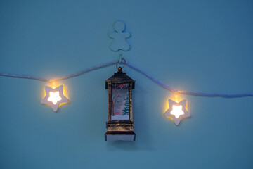 Christmas decorations, lanterns and glowing garlands with balls