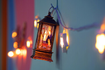 Christmas decorations, lanterns and glowing garlands with balls