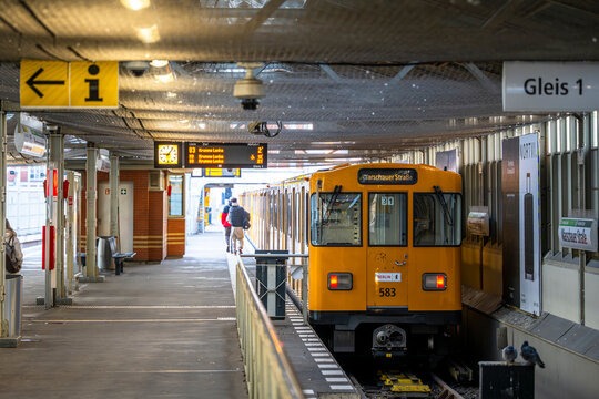 Berlin, Germany - December 26, 2025: Yellow U-Bahn subway train at Warschauer Strasse station platform