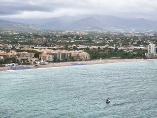 Peaceful coastal scene, Calm waters with distant mountains