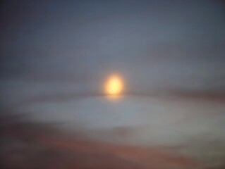 Gentle sunset with halo effects and tranquil atmosphere