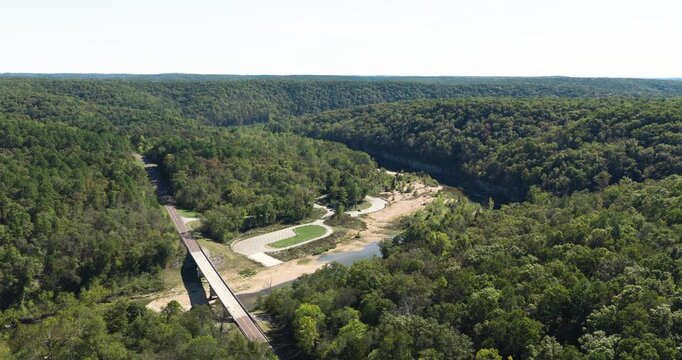 Bridge Across North Fork River Near Campground And Devils Backbone Wilderness In Missouri, USA. wide aerial shot