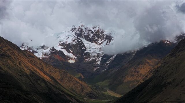 Mount Humantay Salkantay trail Peru aerial drone high altitude Peruvian Andes snow capped glacier peaks Laguna Humantay Lake dry season sunny blue sky morning Anta province circle left motion parallax