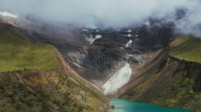 Laguna Humantay Lake Peruvian Andes glacier rainy dry season sunny cloud movement morning snow capped Mount Humantay Peru aerial drone glacial alpine lake Anta province high altitude parallax zoom in