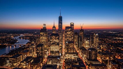Illuminated urban cityscape at dusk with towering skyscrapers and glowing city lights, showcasing a vibrant modern metropolis.