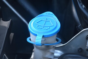 blue cap of water tanker for car windshield wiper and filling clean fresh water 