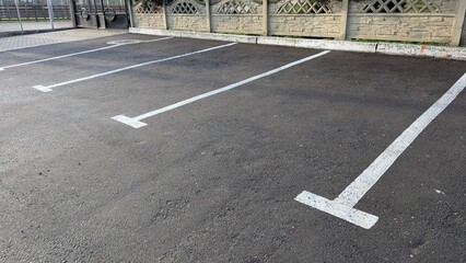 Concrete Parking Area, An Empty Roadway Surface With Aligned Parking Zones And Subdued Morning Light © my1px