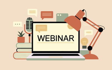 Online seminar presentation on a laptop with microphone and lamp