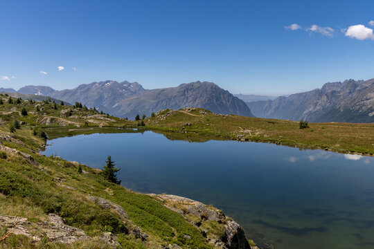 Scenic Lake Besson in the French Alps, located northeast of Alpe d&rsquo;Huez in the Grandes Rousses massif