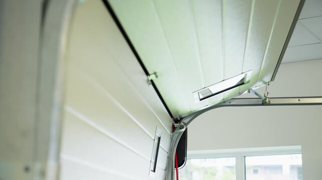 Automatic garage door opening with smart home technology demonstrating modern residential automation convenience safety and innovative living solutions. High quality 4k footage