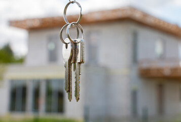 A bunch of keys to a new, unfinished house. A dream of families. Building your private home in Europe